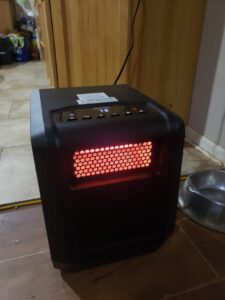 BLACK+DECKER infrared heater review — compact infrared space heater glowing on a 75°F setting