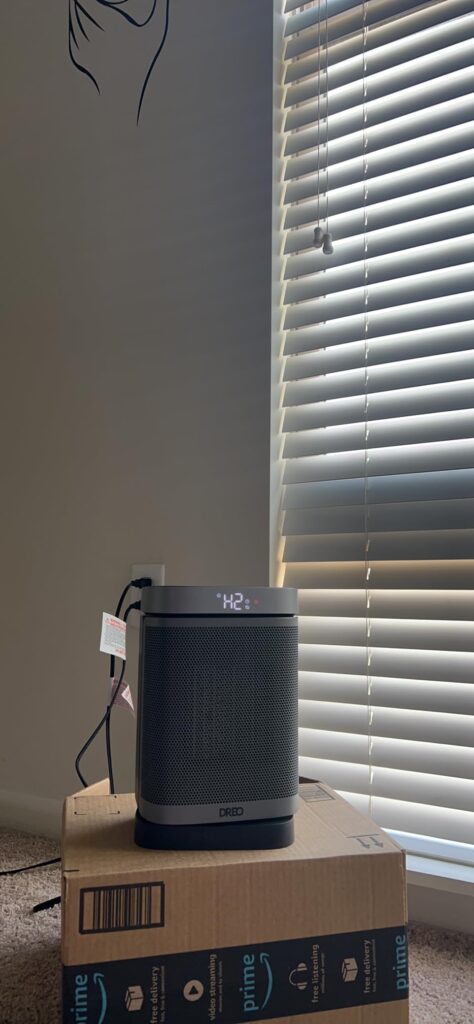 Dreo Atom One DR-HSH004-G space heater running on H2 mode near a window