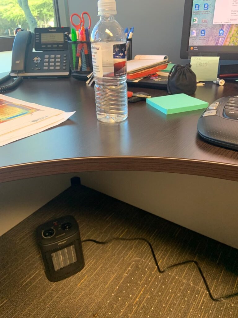 Aikoper ceramic space heater under an office desk warming the leg area