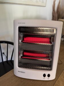 SONBION radiant space heater review — front view of the infrared quartz heater with two glowing elements behind a safety mesh