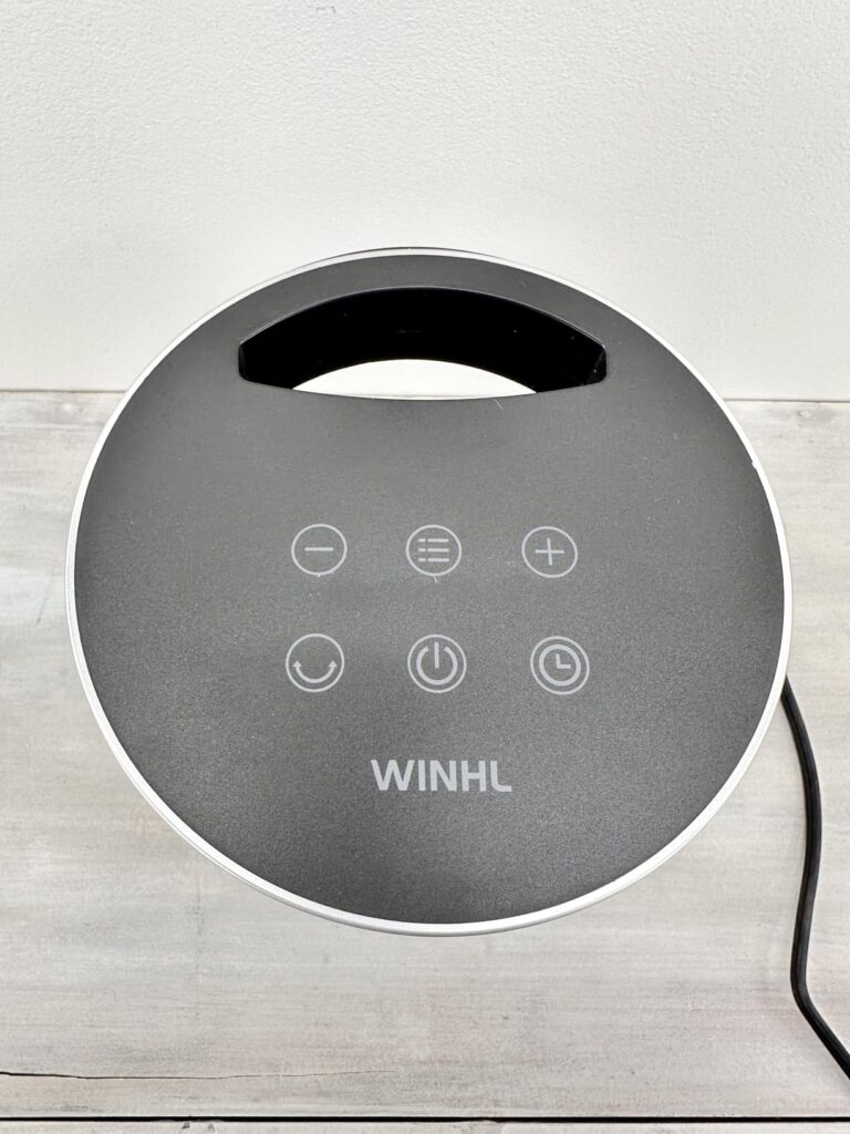 WINHL portable space heater control panel — touch buttons and built-in carry handle