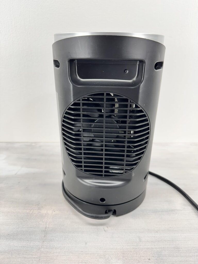 Back view of the WINHL portable space heater — rear fan grille, handle slot, and power cord