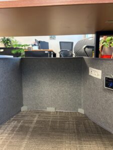 WhisperHeat portable under desk heater installed under an office workstation