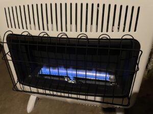 Mr. Heater F299731 30,000 BTU blue flame heater close-up with floor stand installed