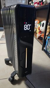 Dreo DR-HSH011 oil-filled radiator heater running in ECO mode with digital display set to 80°F