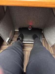 WhisperHeat under desk warmer in use for feet and leg warmth at an office desk