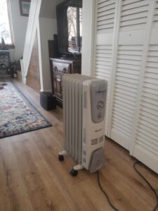 COSTWAY portable oil-filled radiator heater used indoors for supplemental room heat